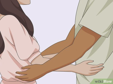 Step 2 Step forward and put your left arm between his right arm and side of his body.